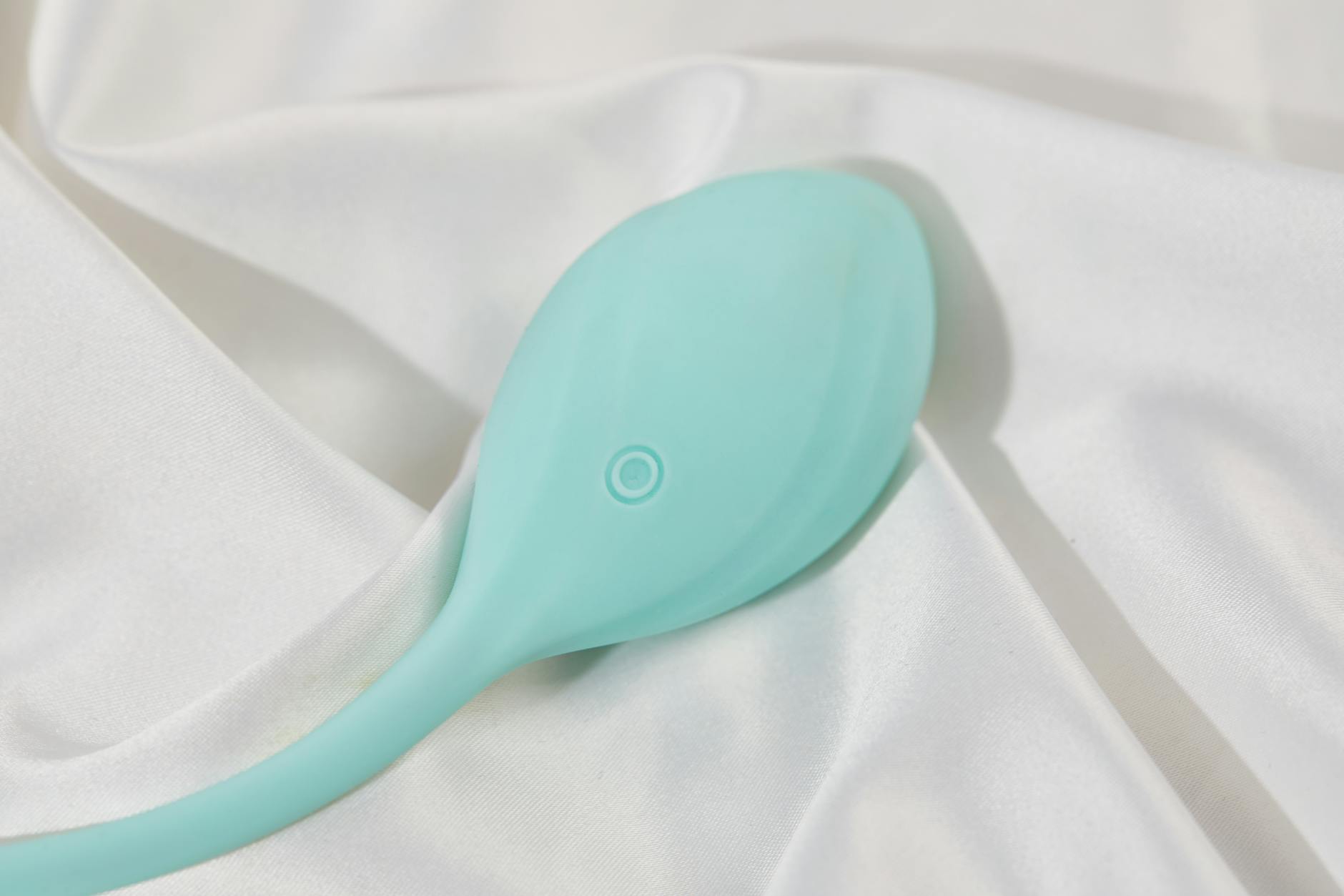 Woman holding colorful vibrators, representing the journey back to pleasure