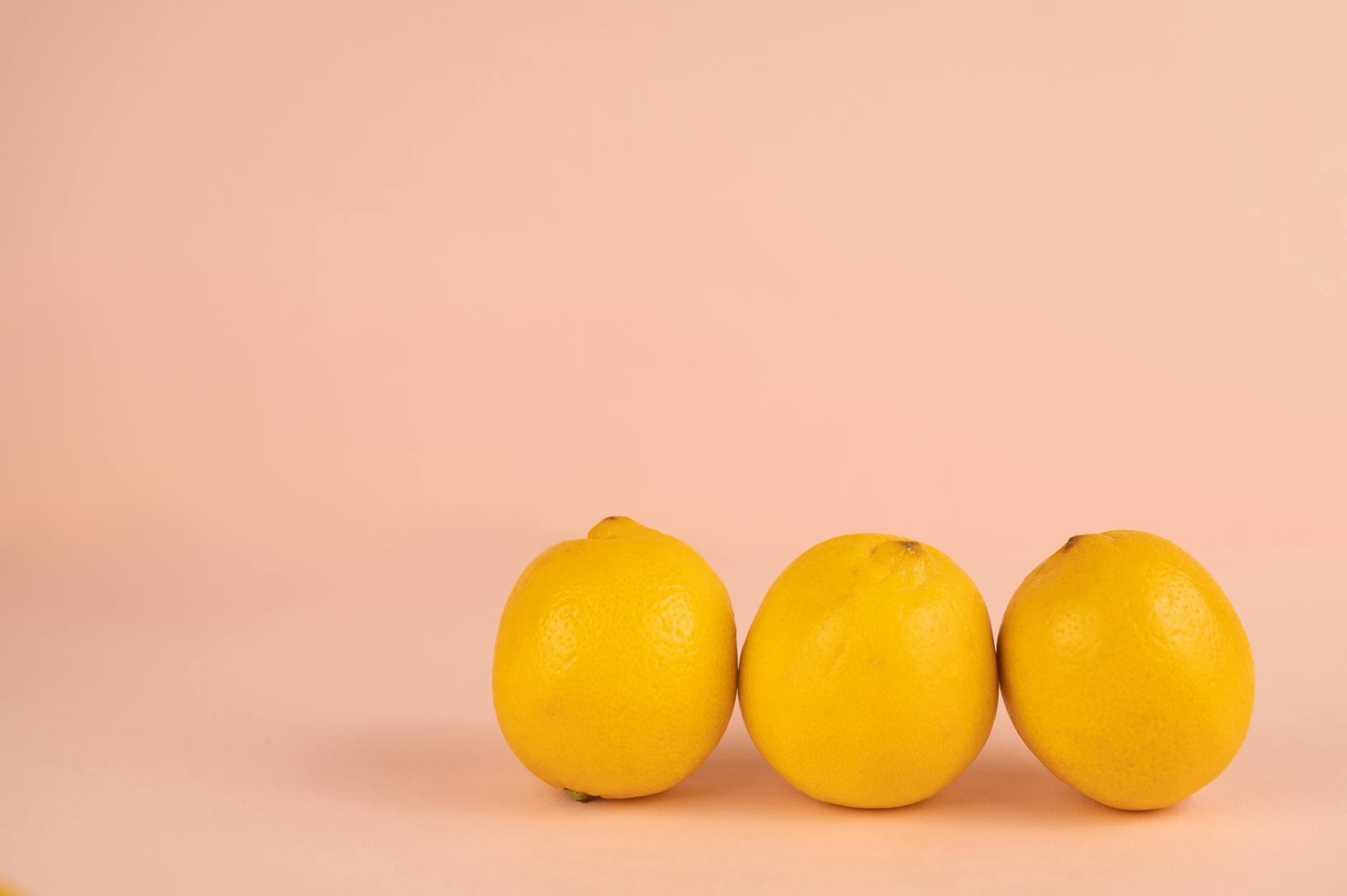 Bright yellow lemons on a soft pastel background, symbolizing renewal and gentle recovery